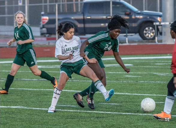 In this file photo, Lake Ridge midfielder Koraima Quiroz fights for the ball during a home victory against Waxahachie in 2015.