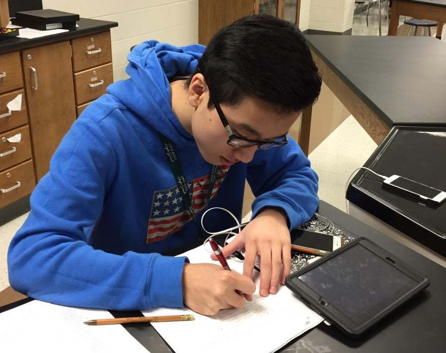 Tommy Nguyen Junior, working in AP Chemistry.