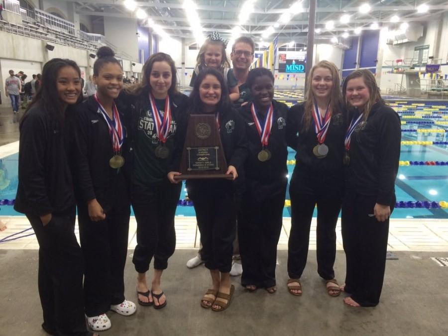 Lady+Eagle+Swim+team+poses+with+their+trophy