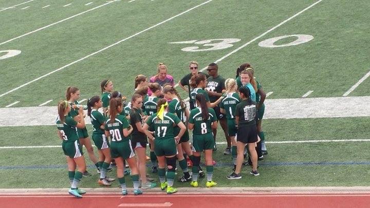 Lady Eagles huddle during the regional finals