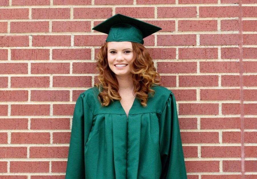 Senior Ashley Baldwin poses in her cap and gown