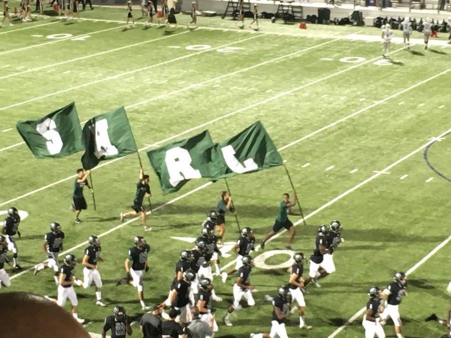 Kevin Ross(L), Shaelyn Handy(R), Chris Grant(H), and Chris Morales(S) running the flags after the Eagles scored a touch down.