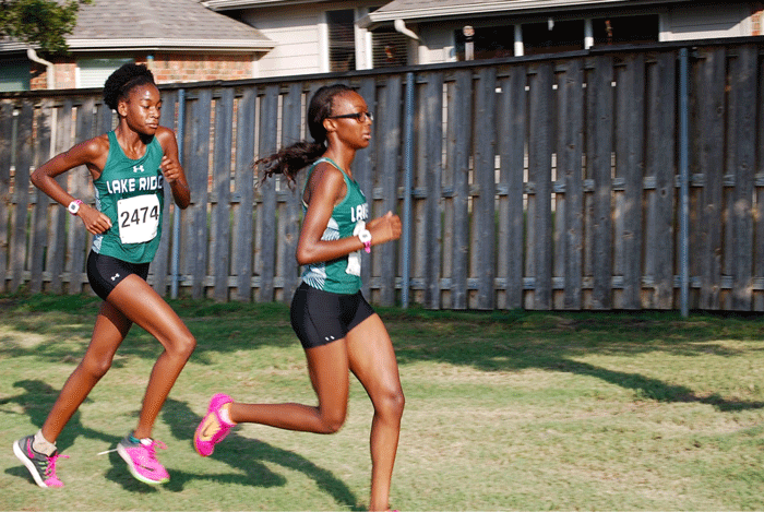 Mackenzi Otakpor (left) and Taylor Hayes (Right) running at the meet