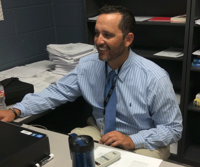 New teacher Christopher Allen working at his new high school. 