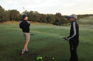 Thomas Andrews (left) and Fabian Olguin (right) at the driving range before the tournament starts