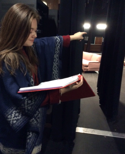 Hannah Raymond helping in theatre