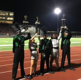 The Drum Majors and Color Guard captains accept their trophies