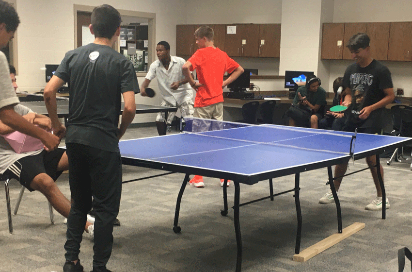 Senior Victor Gonzalez (pictured far right) is having fun in Mr. Riyantos ping ping club after school. 