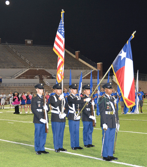 Lake Ridge JROTC presents flag before a football game