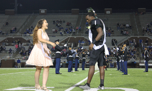 Wren Arevalo (left) and Seth Ette (right) laugh while on the homecoming field.