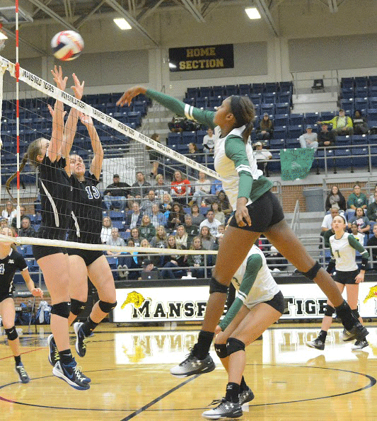 Freshman Madison Williams helps her varsity team score a point.