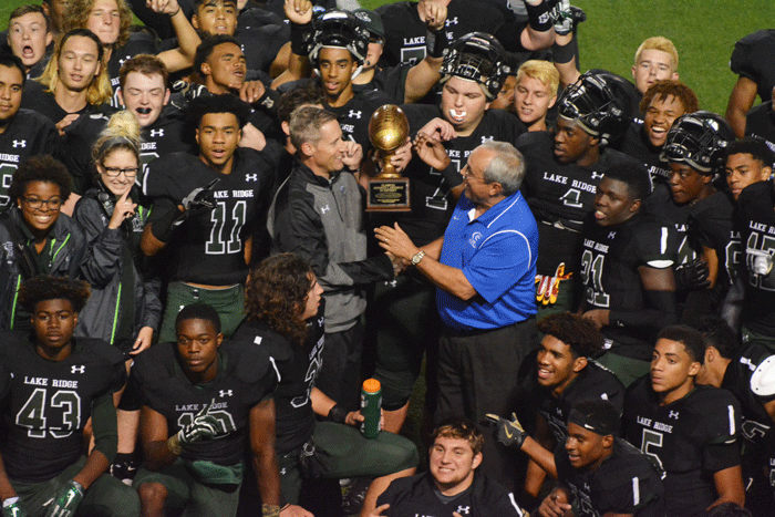 Lake Ridge receives a trophy after beating Crowley and advancing into the second round of the playoffs.