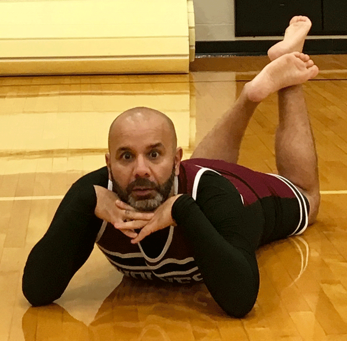 Coach Sohel dresses as a Timberview Cheerleader after losing bet with Coach Marsh.