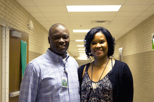 Coach Ross (left) and Mrs. Stewart (right) smile for a picture.