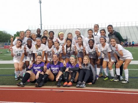 The Soccer Team posing for a picture after the game.