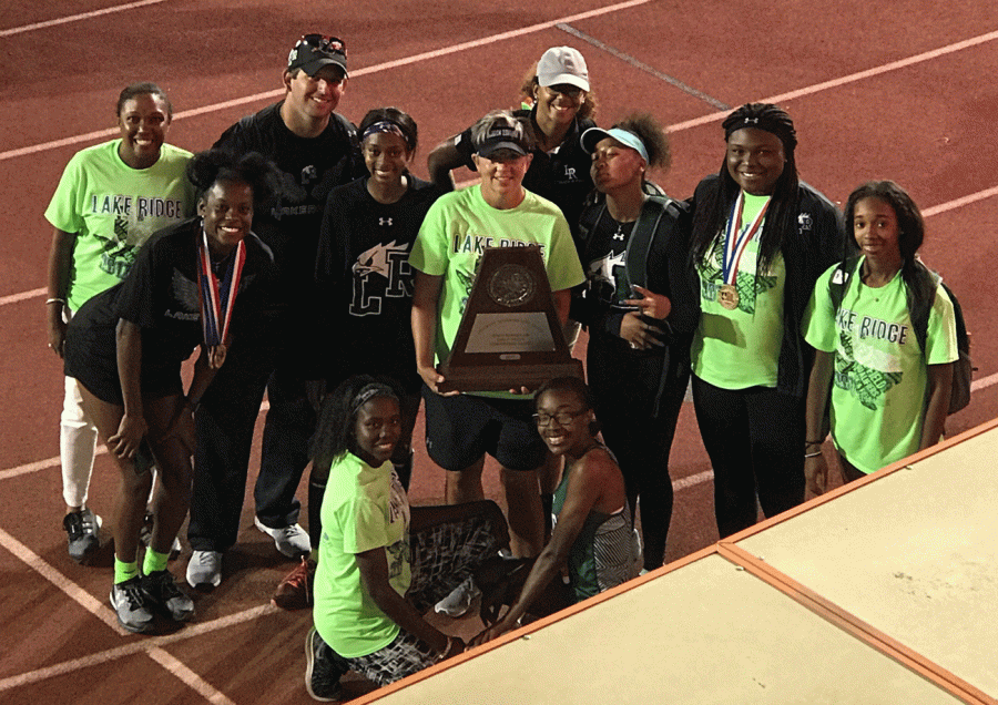 Girls Track Team posing for a picture with their runner up trophy.