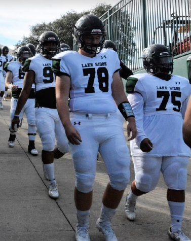 Cade Hutchison takes the field for the varsity football team.