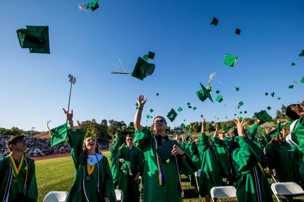 Brea Olinda High School graduates celebrate by thowing their caps into the air as their graduation ceremony ends in Brea on Friday, June 16, 2017. (Photo by Paul Rodriguez, Orange County Register/SCNG)