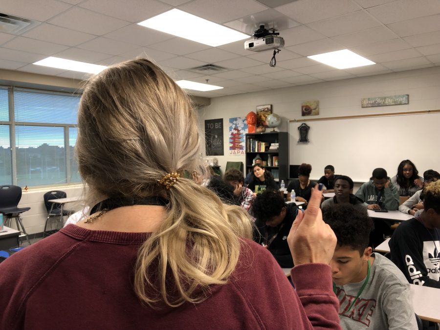 A teacher at Lake Ridge High School lectures her class, asking them to go onto Canvas to work on an assignment.